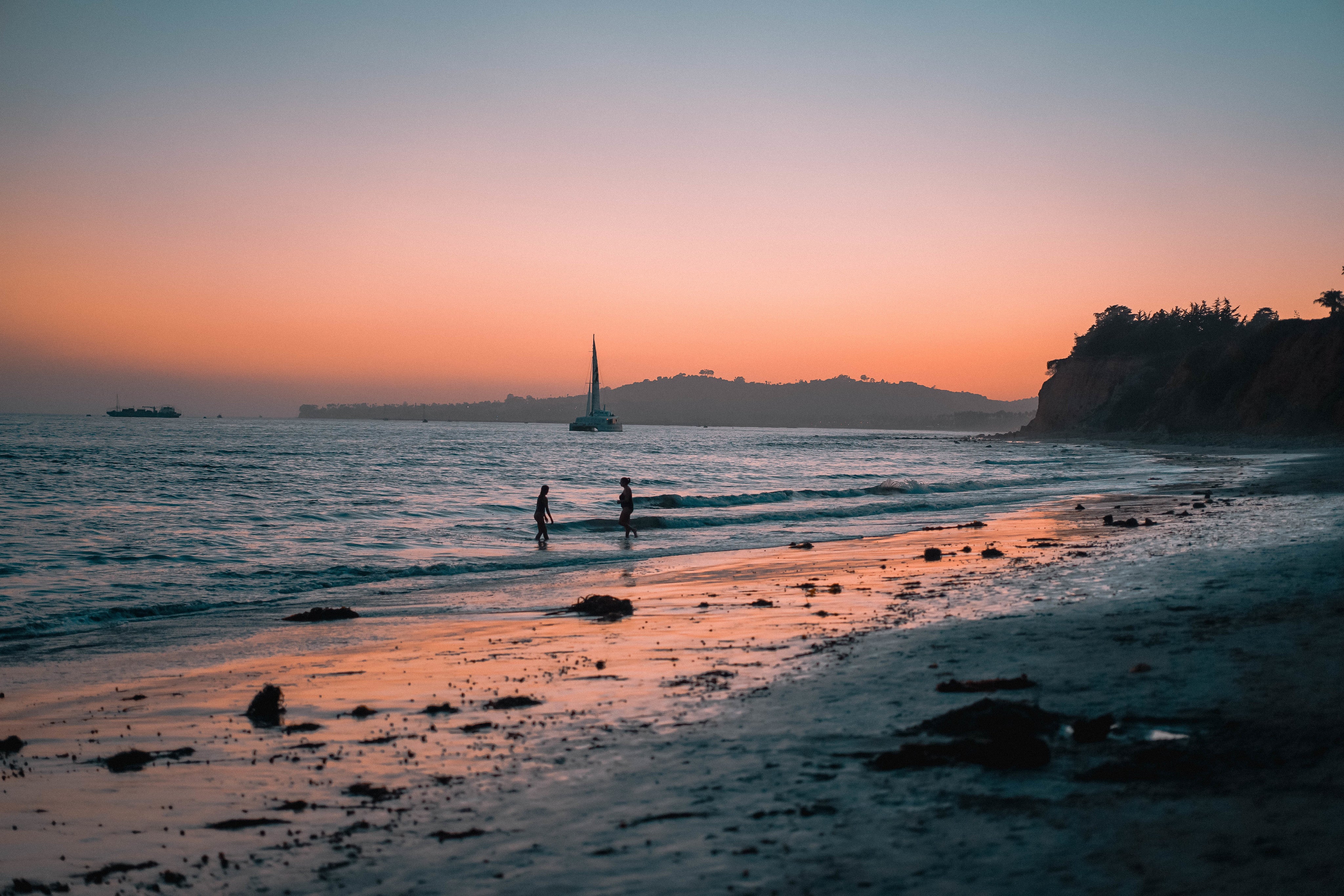 Women Playing on the Beach at Sunset