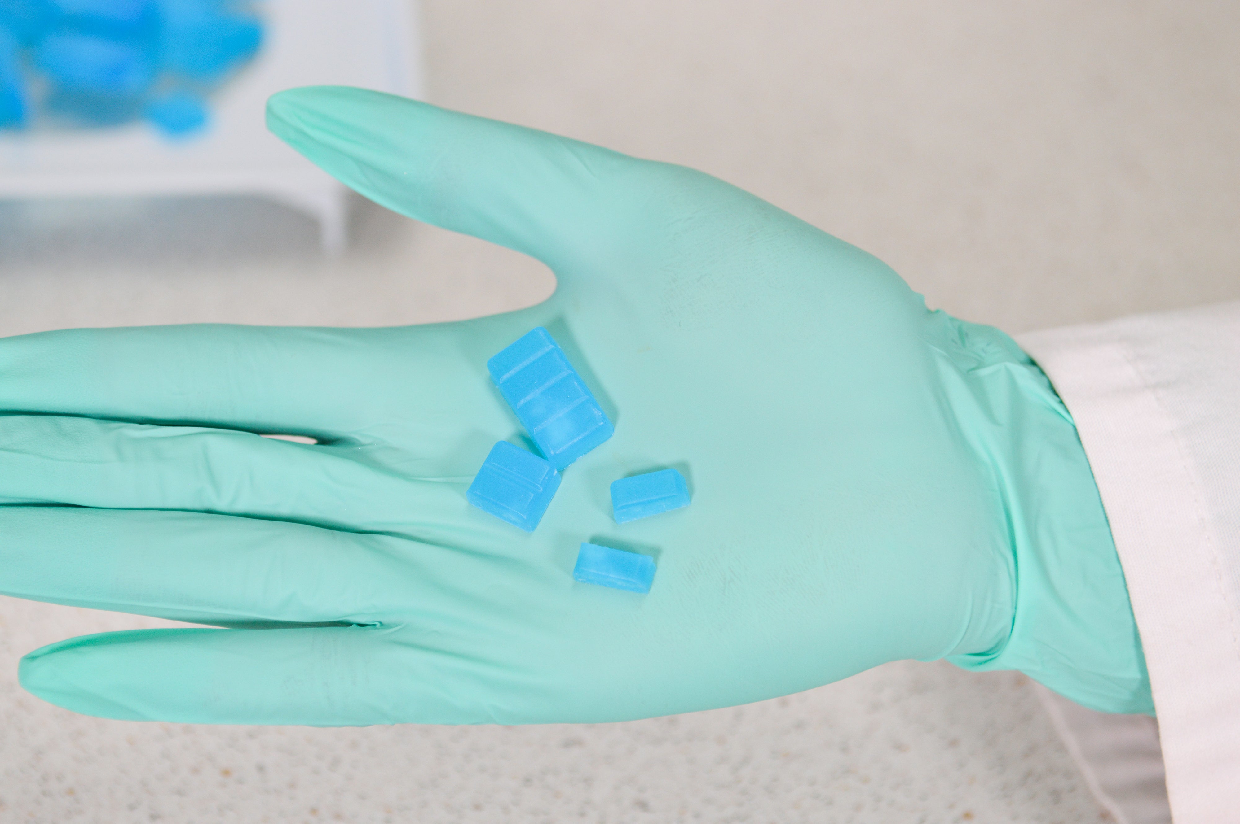 Quarter- and half-troches on PPE in a compounding lab. RD Troches for maximum patient ease of use for compounded troches